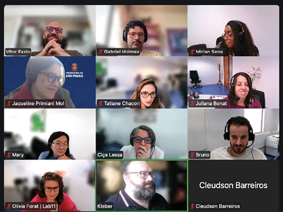A computer screen with a video conference on it. Description generated by AI