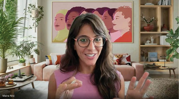 A woman wearing glasses and a pink shirt. Description generated by AI