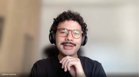 A man wearing glasses and headphones. Description generated by AI