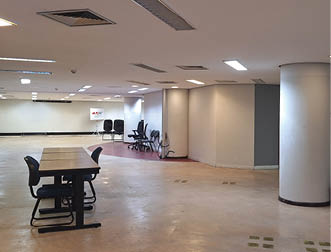 A large room with a white floor and white walls. Description generated by AI
