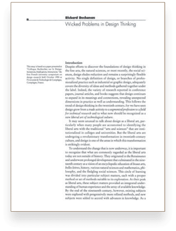 A book is open to a page with the title “Wicked Problems in Design Thinking". Description generated by AI